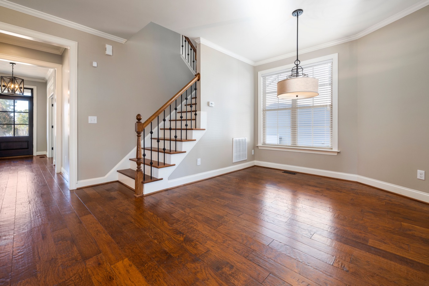 Empty home staircase and living area ready for move-in after cleaning